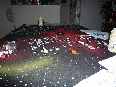Close-up of the Imperial line of battle, made up of starship miniatures placed on a starfield battlemat